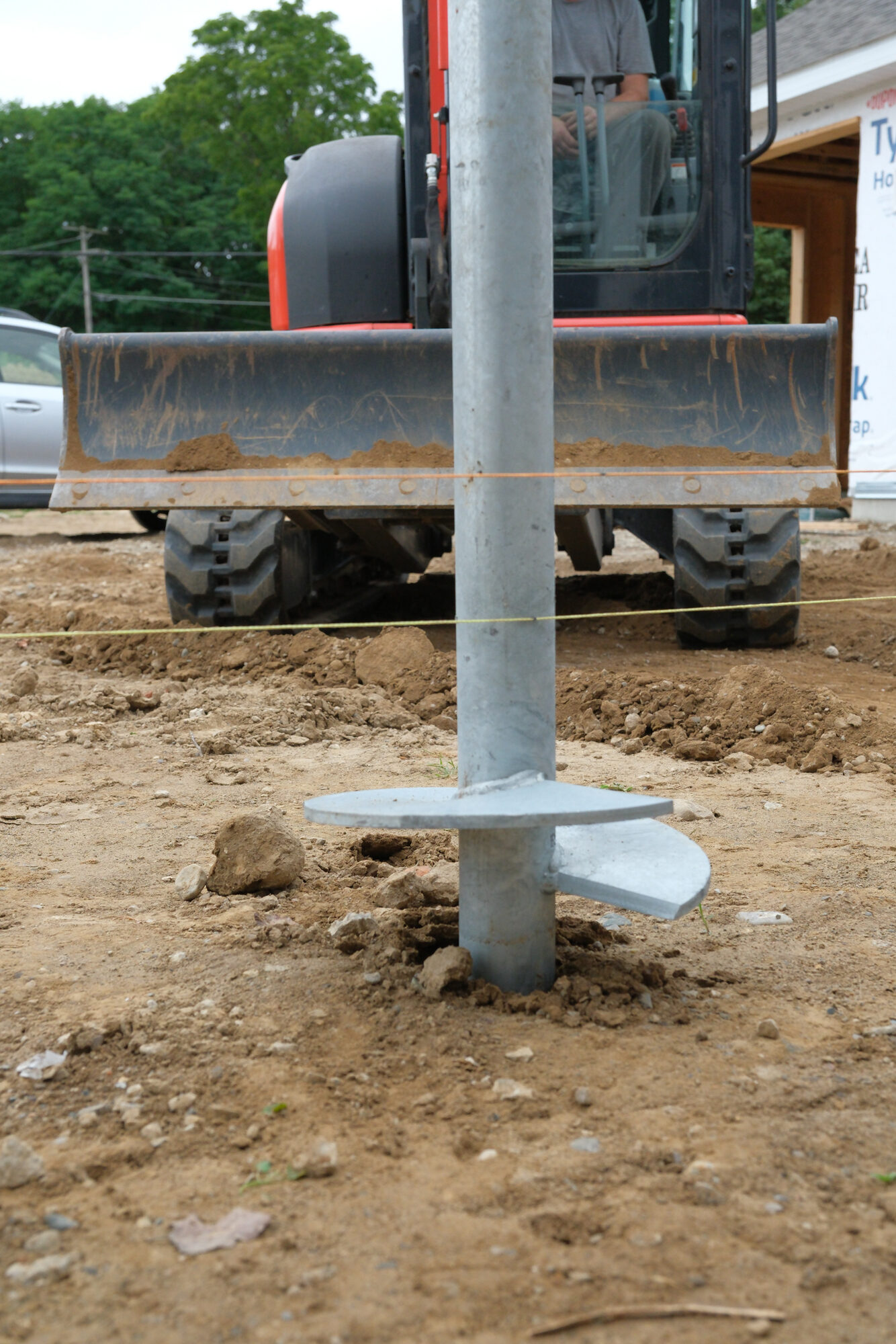 Helix plate of a helical pier entering the ground